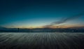 Wooden balcony terrace with early morning silhouette city skyline Royalty Free Stock Photo