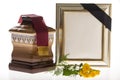 Wooden ballot box with blank mourning frame and flower