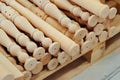 Wooden baluster stacked on the floor in woodwork workshop