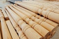 Wooden baluster stacked on the floor in woodwork workshop