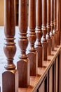 Wooden balustrade of classic staircase in modern house. Close-up Royalty Free Stock Photo