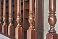 Wooden balustrade of classic staircase in modern house. Close-up Royalty Free Stock Photo