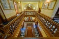 Wooden balustrades line stairwells that connect three floors of the State Capitol in Cheyenne, Wyoming, USA - July 25, 2014