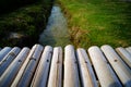 Wooden bamboo bridge across watercourse rice field Royalty Free Stock Photo