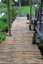 Wooden bamboo bridge walkway in the garden Royalty Free Stock Photo
