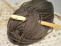 Wooden bamboo crochet hook in bundle of yarn