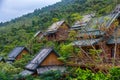 Wooden bamboo houses in the jungle. Sanya Li and Miao Village. H