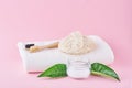 Wooden bamboo toothbrushes and baking soda on a pink background. Dental care and hygiene concept