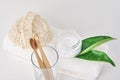 Wooden bamboo toothbrushes in glass, baking soda and towel on a white background. Personal hygiene concept Royalty Free Stock Photo