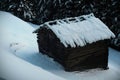 Wooden barn in Alps mountains. Wooden barn covered with snow Royalty Free Stock Photo