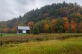 Barn in rural landscape on a rainy autumn day Royalty Free Stock Photo