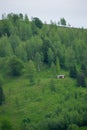 Wooden barn on a green hill Royalty Free Stock Photo