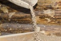 Wooden barn for storing oat grains, beans bowl, malt or wheat grains, dried peas. Food and agriculture concept