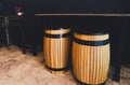 The wooden barrel as seats place with marble table. The set of black antique wooden chairs and desk in the nearby. The interior Royalty Free Stock Photo