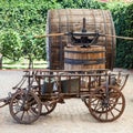 Old wooden barrel and press for making wine.