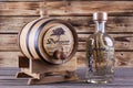 Wooden barrel on a wooden background.