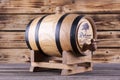 Wooden barrel on a wooden background.