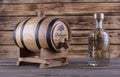 Wooden barrel on a wooden background.