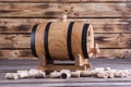 Wooden barrel on a wooden background.