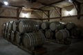 Wooden barrels of aged cognac at cellar of Brandy Factory Noy of Yerevan Royalty Free Stock Photo