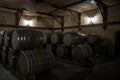 Wooden barrels of aged cognac at cellar of Brandy Factory Noy Royalty Free Stock Photo