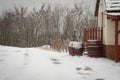 Wooden barrels covered with snow