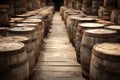 Wooden barrels lining a path, storing liquids in an old cellar Royalty Free Stock Photo