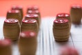 Wooden barrels for playing lotto on game cards, shallow depth of field, some details are out of focus.