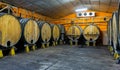 Wooden barrels in rows at contemporary cider actory. Asturias. Spain Royalty Free Stock Photo