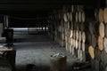 wooden barrels stacked in old abandoned industry building Royalty Free Stock Photo