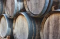 Wooden barrels stacked in a pile with vintage wine Royalty Free Stock Photo