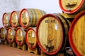 Wooden barrels in a wine cellar in Montalcino, Val d`Orcia, Tusc