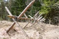 Wooden barricade with a barbed wire