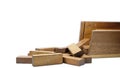 Wooden bars for a board game in a tower puzzle Jenga. Chaotic scattered on a white background Royalty Free Stock Photo