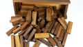 Wooden bars for a board game in a tower puzzle Jenga. Chaotic scattered on a white background Royalty Free Stock Photo