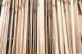 Wooden bars from floor to ceiling in hardware store.Wood timber stack of wooden blanks construction material Royalty Free Stock Photo