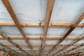 Wooden base for the new ceiling. Repair of the ceiling in an old house. Cellular construction of wooden boards for the