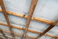 Wooden base for the new ceiling. Repair of the ceiling in an old house. Cellular construction of wooden boards for the