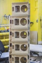 Wooden bases Audio Speakers stacked like a tower at the factory