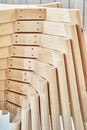 Wooden bases with legs for chairs assembling in paint booth closeup