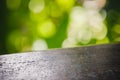 Wooden basis and green nature bokeh background