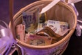 Wooden basket full of money for the bride - romanian wedding tradition Royalty Free Stock Photo