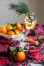 Wooden Basket Mandarine with Leaves and Lights, Tangerine Orange on Gray Table Background Christmas New Year Decors Royalty Free Stock Photo
