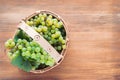 Wooden basket with white grapes. Copy space Vintage Royalty Free Stock Photo