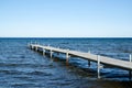 Wooden bath pier in blue water