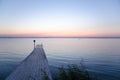 Wooden bath pier at soft colored sunset