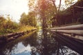 Wooden bathhouse near pond in evening. Forest landskype.