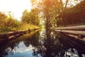 Wooden bathhouse near pond in evening. Forest landskype.