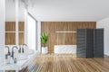 Wooden bathroom with bathtub and sinks near window, black panel wooden screen Royalty Free Stock Photo