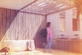 Wooden bathroom interior with a tree, side toned Royalty Free Stock Photo